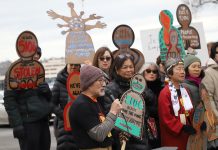 Drawing parallels to EO 9066, activists protest ICE deportation flights out of Boeing Field