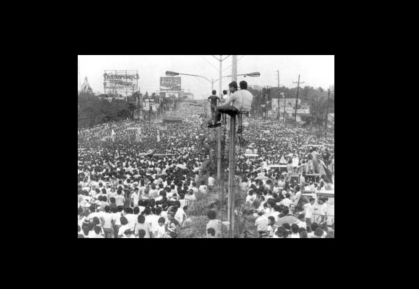 Filipino community members commemorate the 40-year anniversary of the People Power Revolution in the Philippines